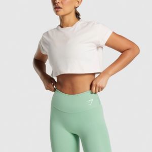 GYMSHARK CAMO GRAPHIC CROPPED TEE CREAM IN SIZE LARGE WITH GYMSHARK LOGO